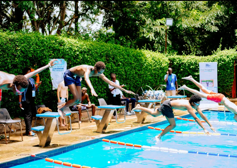 Inspire Stars Academy swimmers diving into the pool