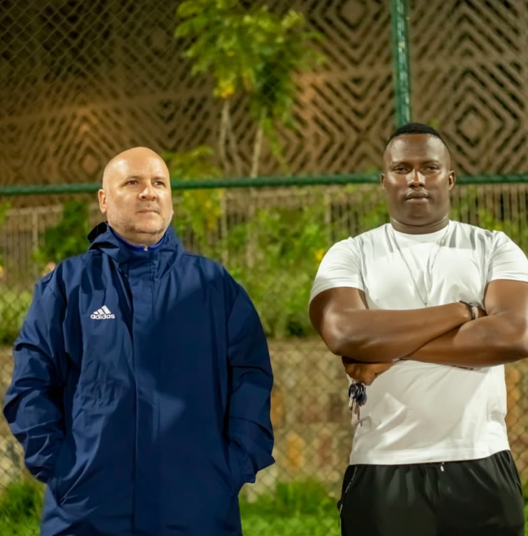 ISA head coach with an international coach on the pitch